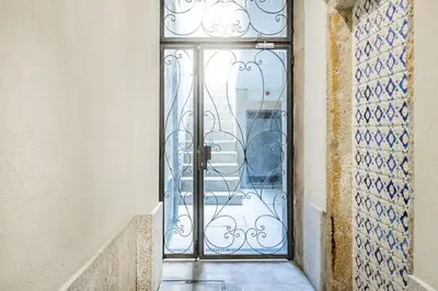 a bedroom with a large bed with a window at BnBird Lifestyle Studio in Porto in Porto