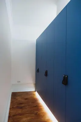 a room with blue lockers and a wooden floor at VIVA 4 Suites Batalha Residence & SIZE Flats Batalha in Porto