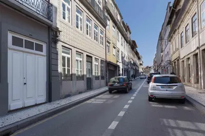 a tall building with many windows on a street at Domus 21 - Formosa in Porto