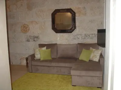 a living room with a couch and a mirror at Downtown Historical Apartment in Porto