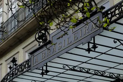 a sign on a building that says a parlaimant at Pestana Porto - A Brasileira, City Center & Heritage Building in Porto