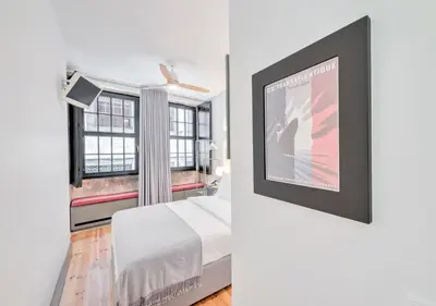a bedroom with a bed and a window at Oporto Street Fonte Taurina - Riverfront Suites in Porto