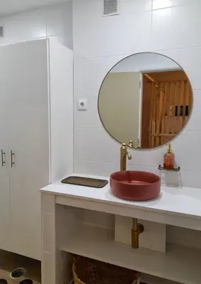 a bathroom with a red sink and a mirror at Flats 323 apartments in Porto