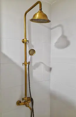 a wall with four pictures and a lamp on it at Flats 323 apartments in Porto