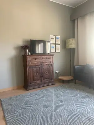 a lamp on top of a dresser in a room at Flats 323 apartments in Porto