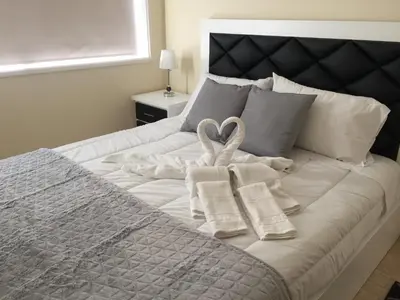 two towels on a bed with two towels at Invicta house Boavista in Porto