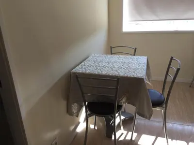 a table with two chairs and a table cloth on it at Invicta house Boavista in Porto