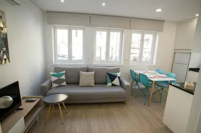 a living room with a couch and a table at Camões 691 Design Apartments by Porto City Hosts in Porto