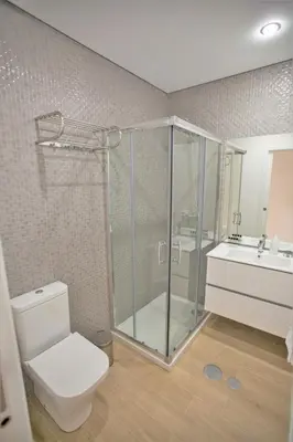 a bathroom with a shower and a toilet and a sink at Camões 691 Design Apartments by Porto City Hosts in Porto