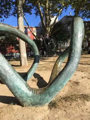 a sculpture of a snake in a park at Virtudes Patio in Porto