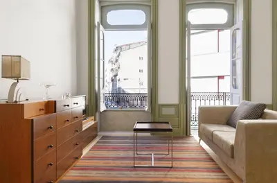 a living room with a couch and a table at HeartMade Loft & Heartmade Studio in Porto