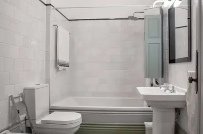 a bathroom with a toilet and a sink and a tub at HeartMade Loft & Heartmade Studio in Porto