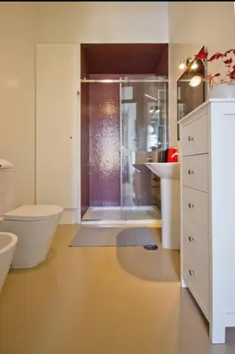 a bathroom with a shower and a toilet and a sink at HeartMade Loft & Heartmade Studio in Porto