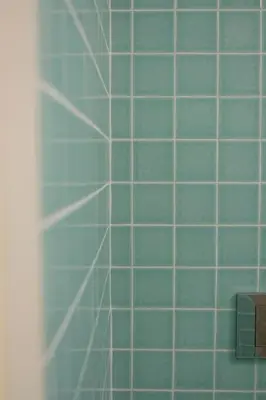 a blue tiled wall in a bathroom at OHH - Ganesha studio- Oporto Center in Porto