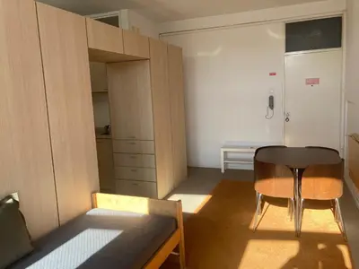 a small room with a table and a chair at PATH Biblioteca Apartment in Porto