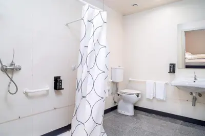 a bathroom with a toilet and a sink at STAYSOME Porto Herculano in Porto