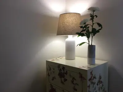 a table with a lamp and a plant on it at Oporto Like Home II in Porto
