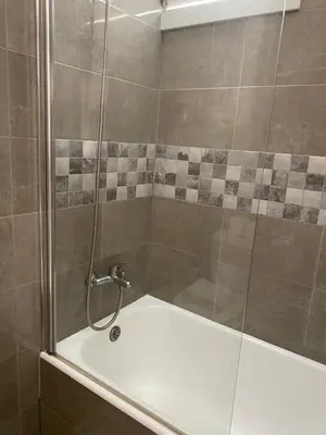 a bathroom with a toilet and a sink and a mirror at GuestHouse Marquês in Porto