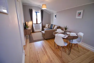 a living room with a table and a couch at D&S - Lapa 32 in Porto