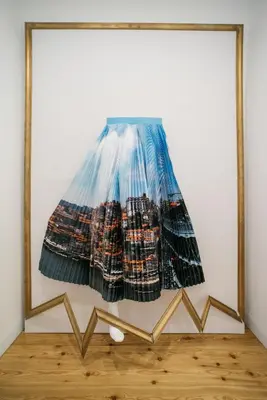 a picture of a skirt in a frame on a wall at D'Autor Apartments Sá da Bandeira in Porto