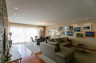 a living room with a couch and a table at Comfy Luxury Apartment in Porto