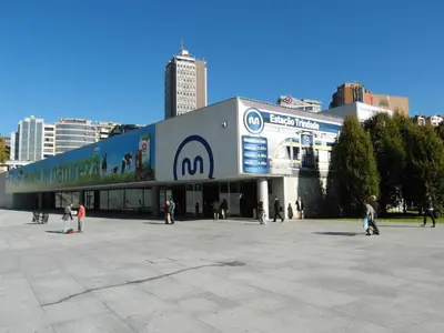 a large building with people standing outside of it at apartment with balcony in the square in Porto
