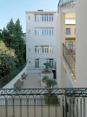 a balcony with a bench and a building at FLH Porto Balcony Apartment in Porto