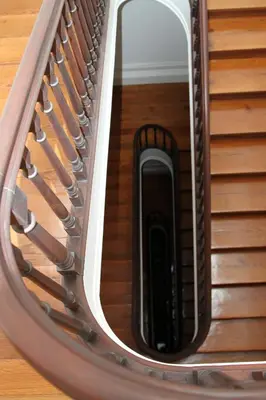 a cell phone on a spiral staircase with a mirror at Porto Feeling in Porto