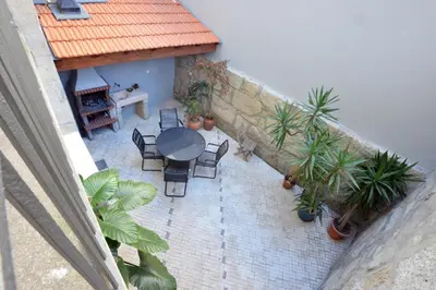 an overhead view of a patio with a table and chairs at Oporto City View - Santo Ildefonso in Porto