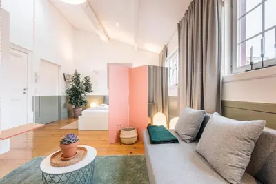 a living room with a couch and a table at GuestReady - Charming Studio in Porto! in Porto