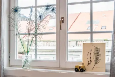 a window sill with a vase and a plant at GuestReady - Charming Studio in Porto! in Porto