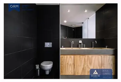 a bathroom with a toilet and a sink and a mirror at ORM - Bainharia Apartment in Porto