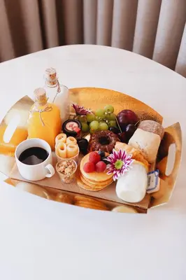 a tray of breakfast foods and coffee on a table at ORM - Bainharia Apartment in Porto