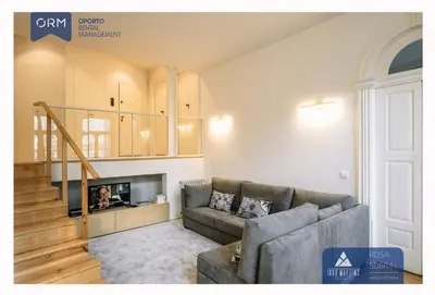 a living room with a couch and a fireplace at ORM - Bainharia Apartment in Porto