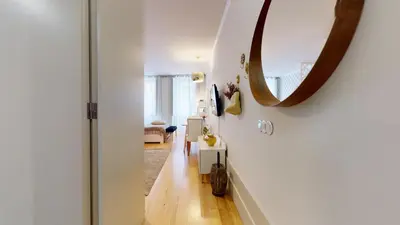 a hallway with a mirror on the wall at Oporto Golden View Vitória in Porto