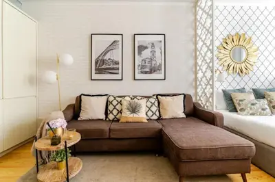 a living room with a couch and a bed at Oporto Golden View Vitória in Porto