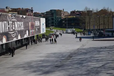 a group of people walking down a street at Suite In in Porto