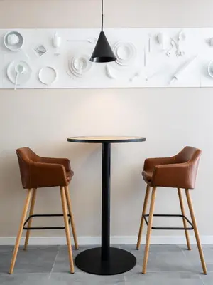 a table with a bowl of food and a glass of wine at Gallery Hostel in Porto