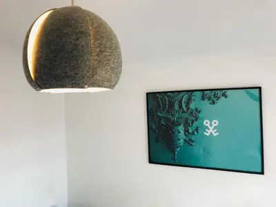 a mirror hanging on a wall next to a tv at Clérigos Apartments in Porto