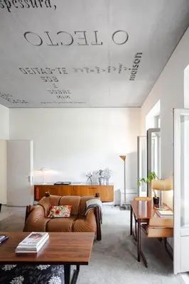 a living room with a couch and a table at Casa do Conto - Arts & Residence in Porto