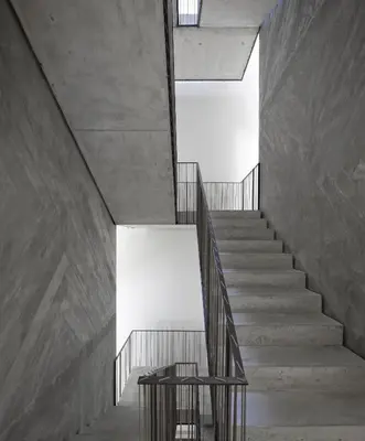 a staircase in a building with a table on it at Casa do Conto - Arts & Residence in Porto