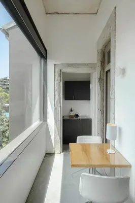 a kitchen and dining room with a table and chairs at Casa do Conto - Arts & Residence in Porto