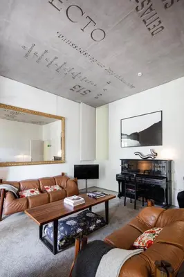 a living room with a couch and a piano at Casa do Conto - Arts & Residence in Porto