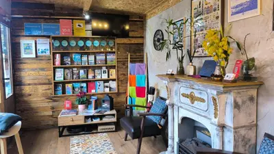a store with a fireplace and a shelf of products at Ruby Charm Houses in Porto