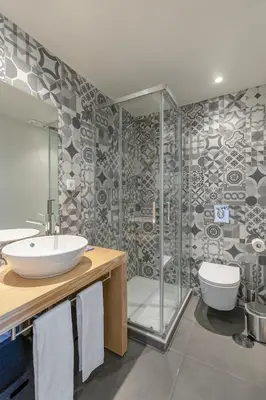 a bathroom with a sink and a shower at Charming City Centre Studio near Aliados - Inside Porto Apartments 