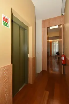 an empty hallway with a door to a room at GR Suites in Porto
