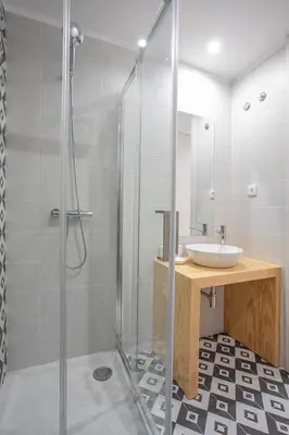 a bathroom with a shower and a sink at ORM - Mártires & Pinheiro Apartments in Porto