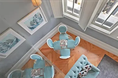 an overhead view of a living room with a table and chairs at Villa Mouzinho by ON Apartments in Porto