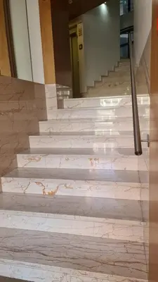a set of marble stairs in a building at Lux Bolhão - ALL INCLUDED in Porto