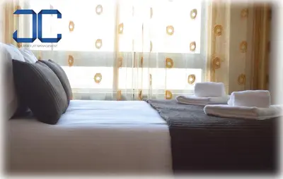 a hotel room with a bed with towels on it at Learn Porto Apartment by JC in Porto